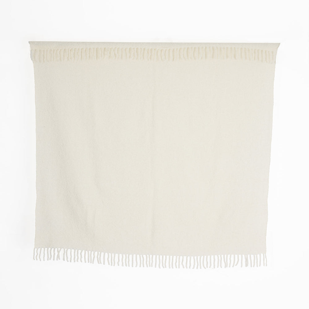 A handwoven ivory throw with a knobby texture, displayed against a plain background.