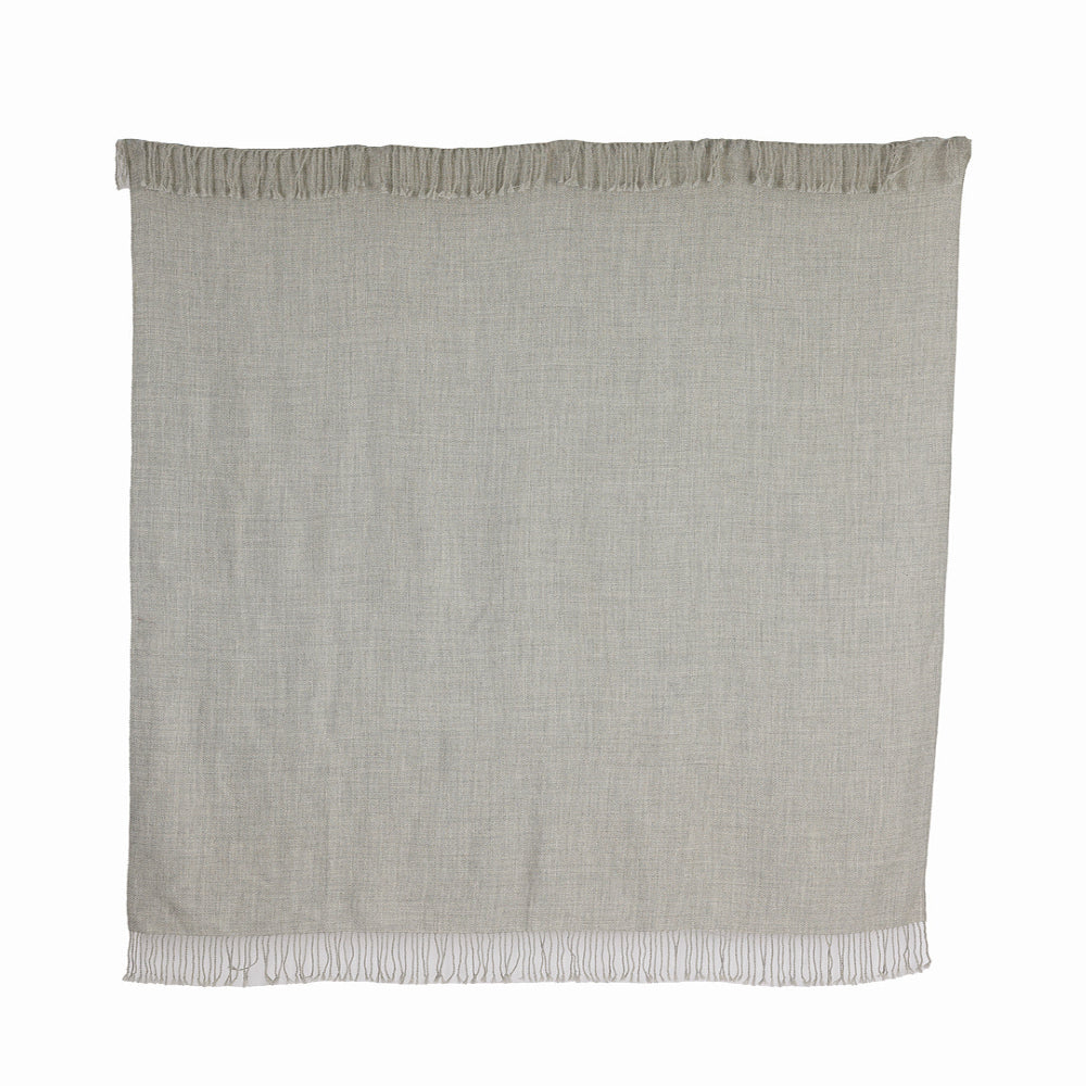 A graphite gray baby alpaca throw with fringes, handwoven and displaying the natural texture of the fiber.