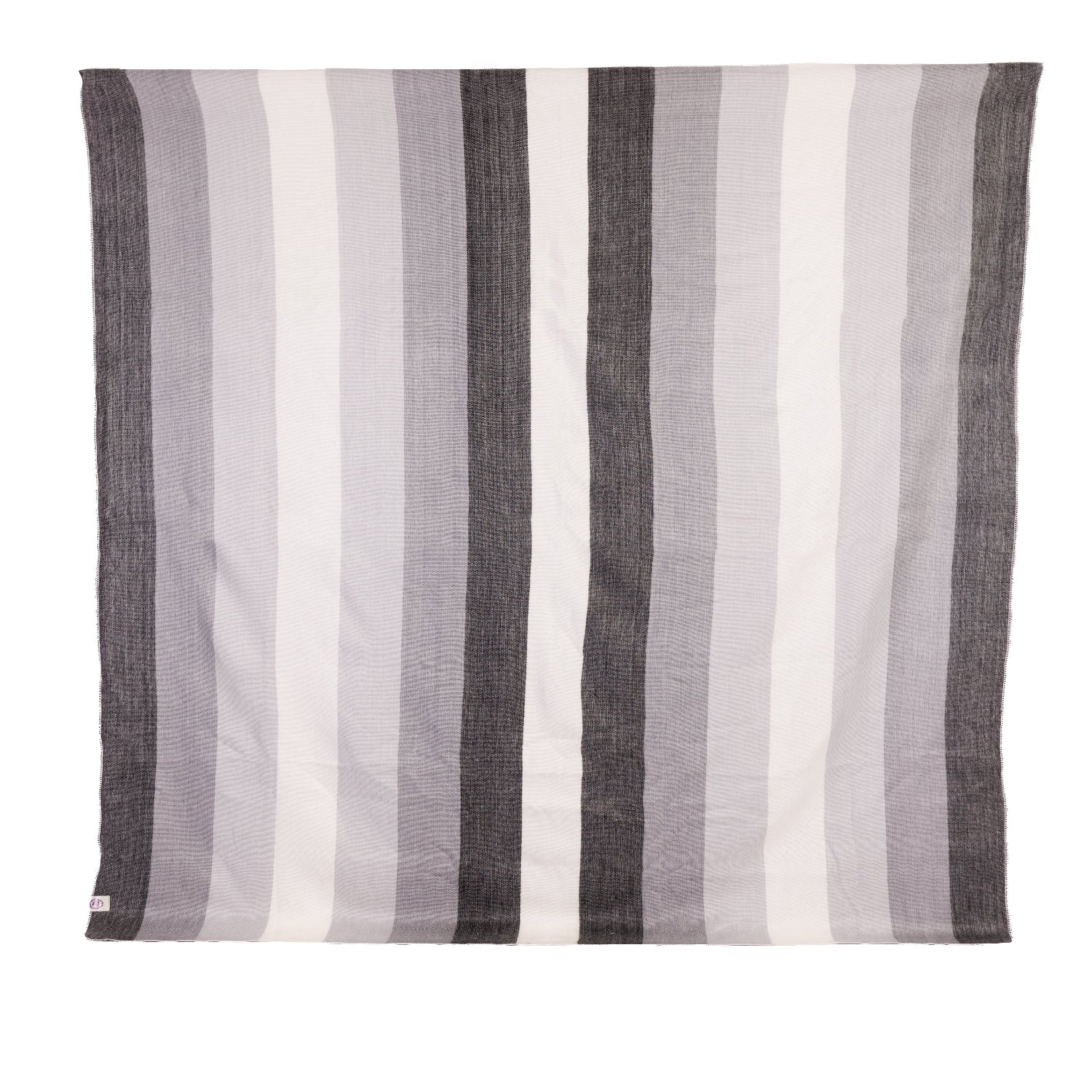 A striped throw blanket in black, gray, and white, with a visible brand tag on the lower corner.