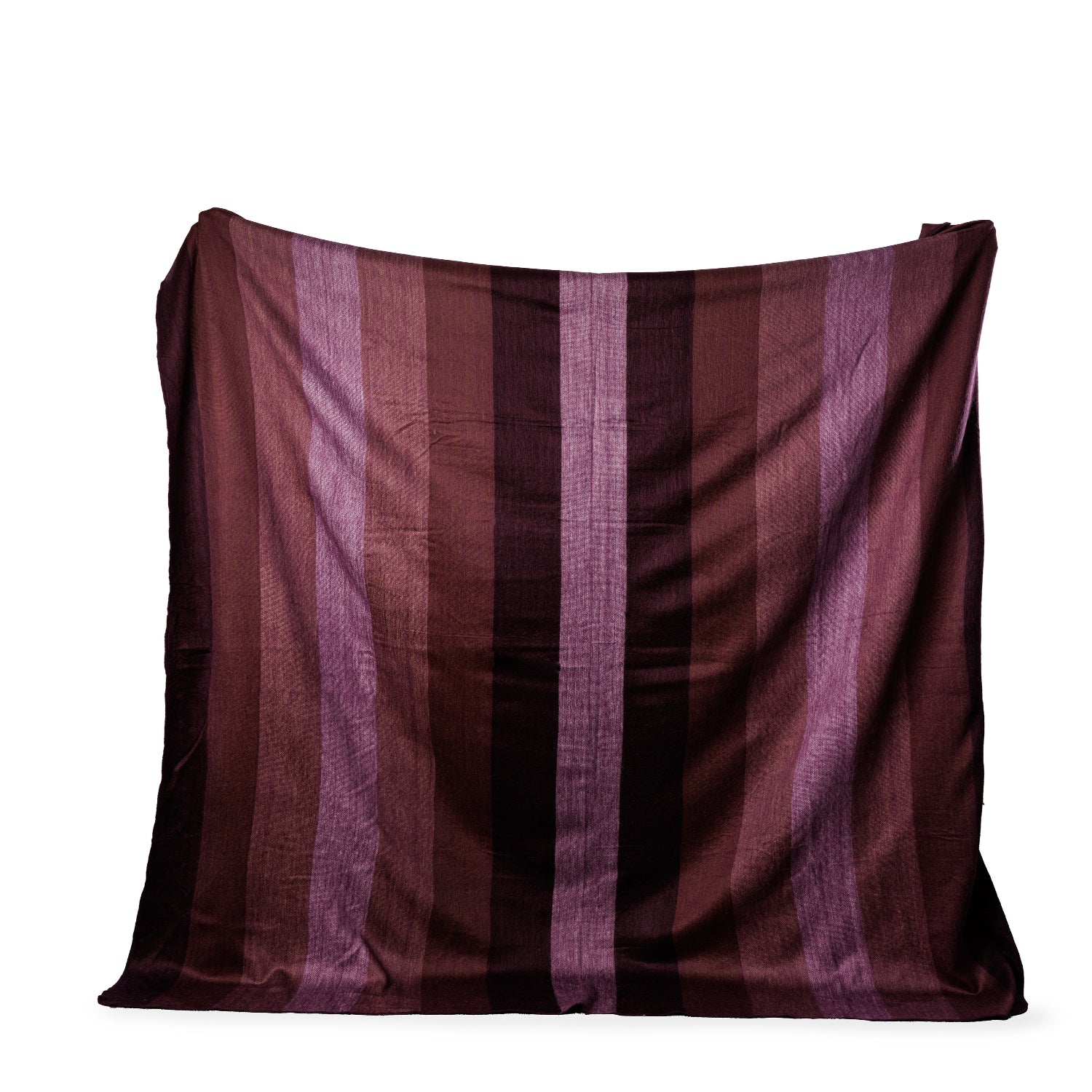 A folded throw blanket in shades of deep purple, with a subtle striped pattern and hand-sewn edges.