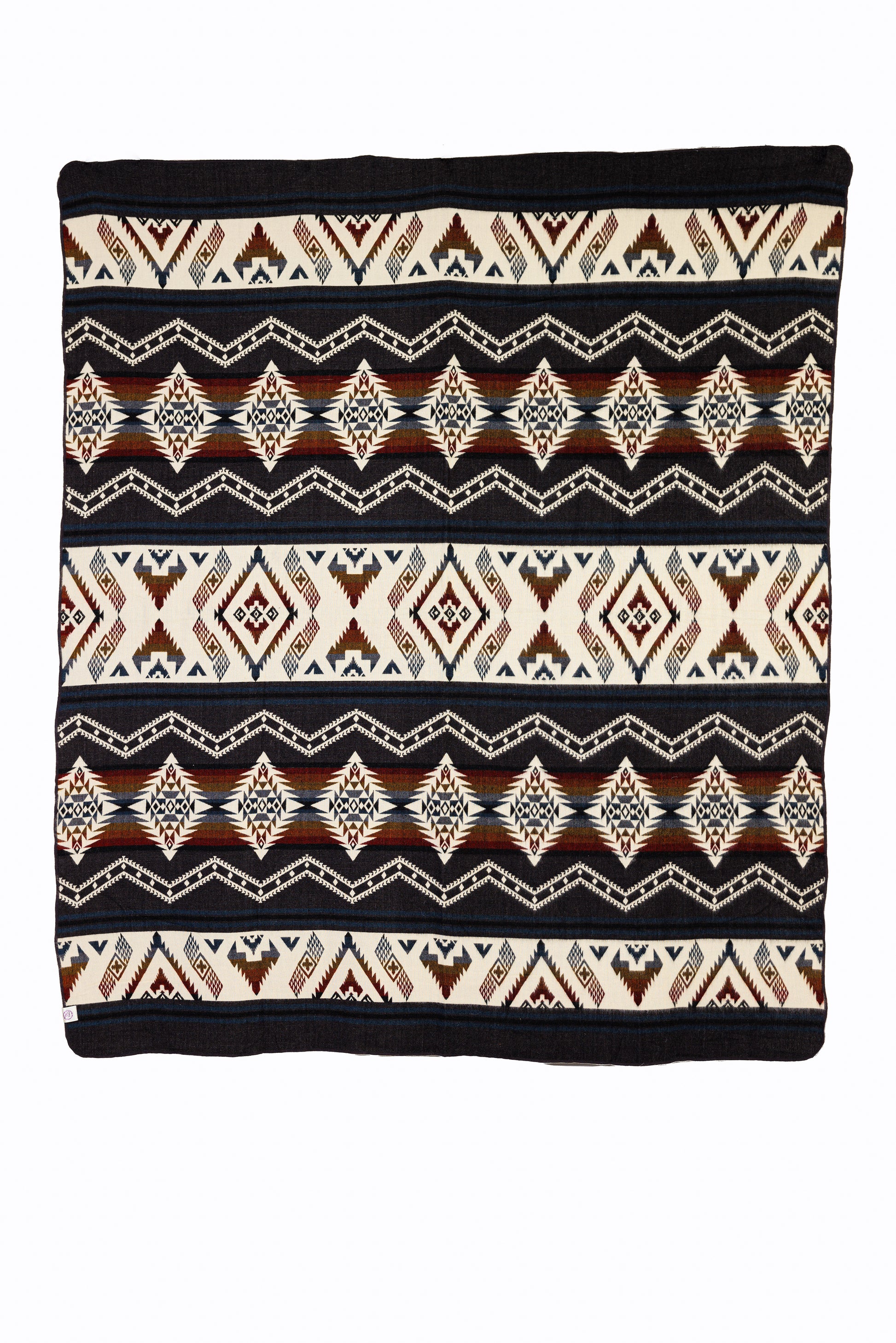 A woven throw blanket featuring a geometric pattern with shades of brown and dark red.