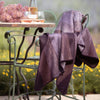 purple throw blanket on outdoor patio chair