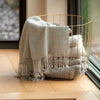 Cream artisanal woven throw with fringe