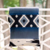 Navy artisanal woven throw with white diamonds