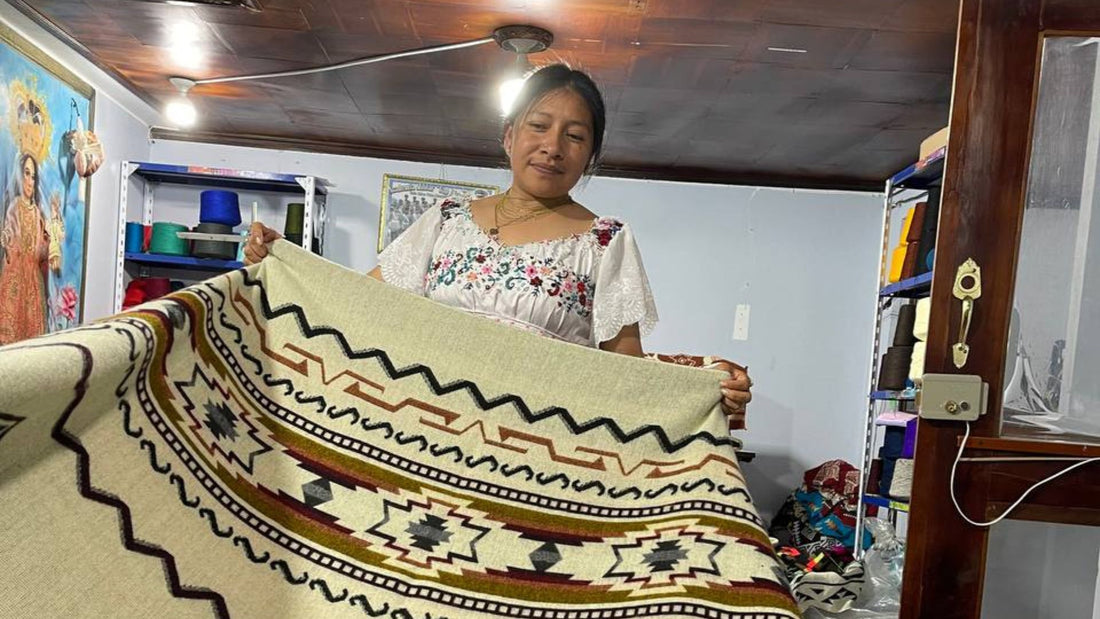 Person holding intricate woven textile in colorful craft workshop setting