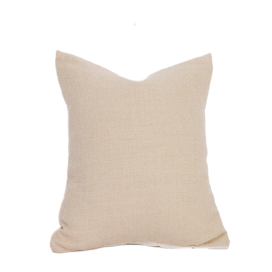 An undyed light beige baby alpaca pillow with a hidden zipper and a down pillow insert, on a white background.