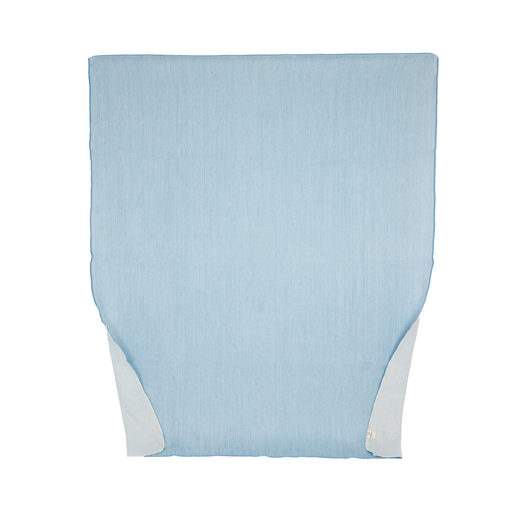 A reversible powder blue and white throw blanket made from alpaca yarn, displayed flat.
