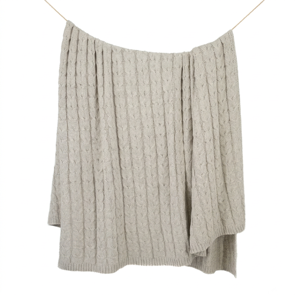 Square hanging cable-knit blanket on white