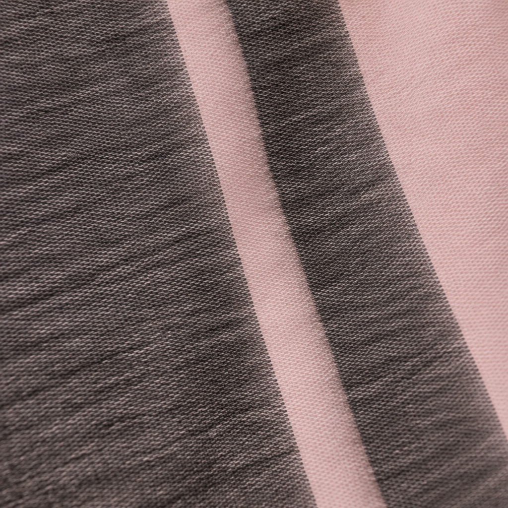 Square pink and charcoal textile close-up