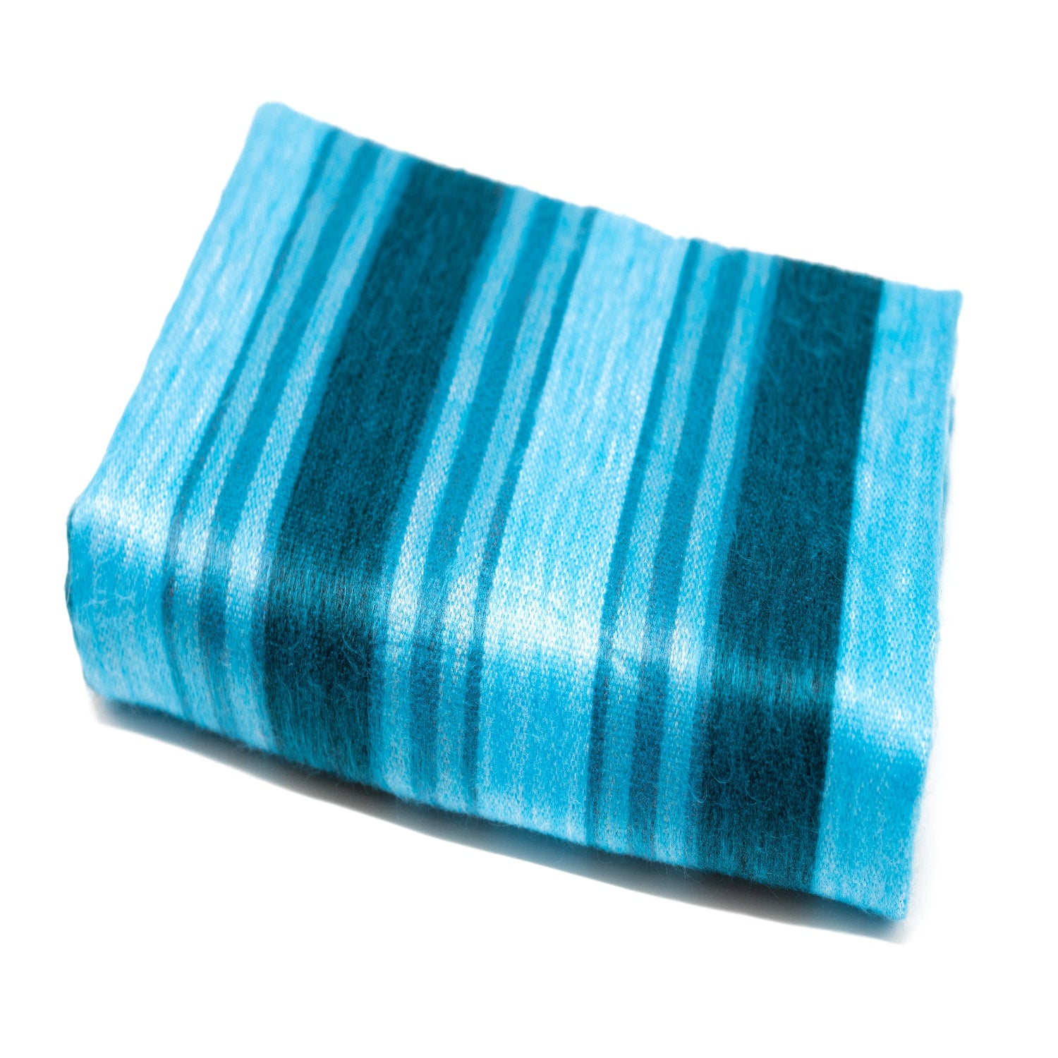 A folded striped throw blanket in shades of blue, with a soft and lustrous finish.